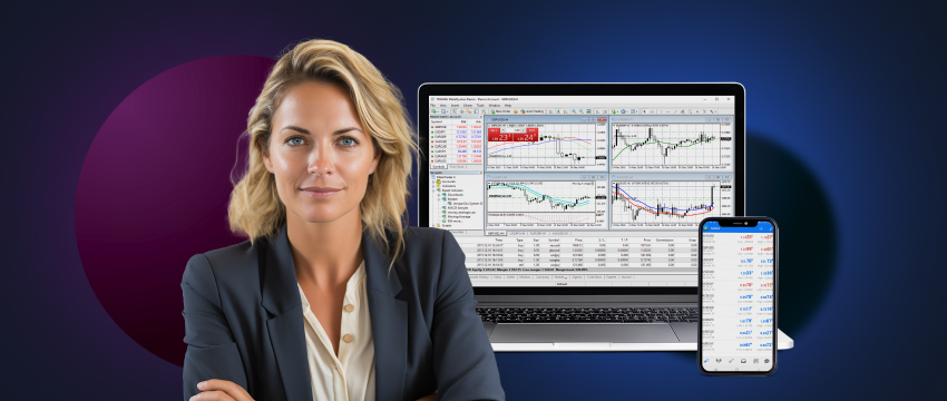 A professional woman in a business suit sits in front of a laptop and computer screen, engaged in CFD trading on her MT4 mobile app.