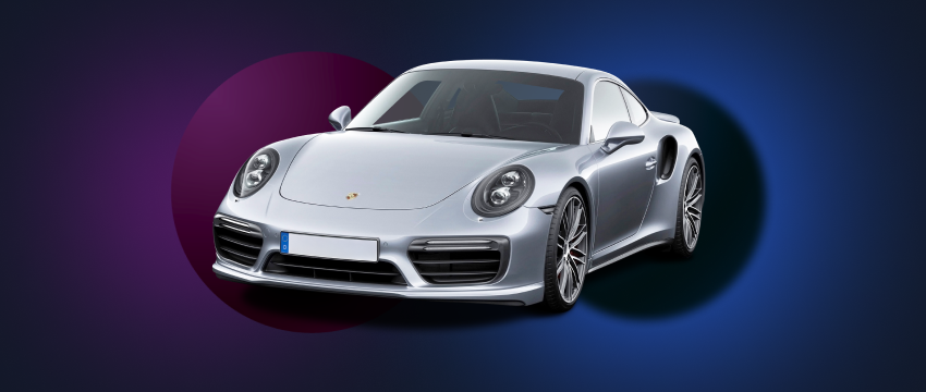 A stunning silver Porsche sports car set against a rich purple background, representing the ultimate in luxury and sport.