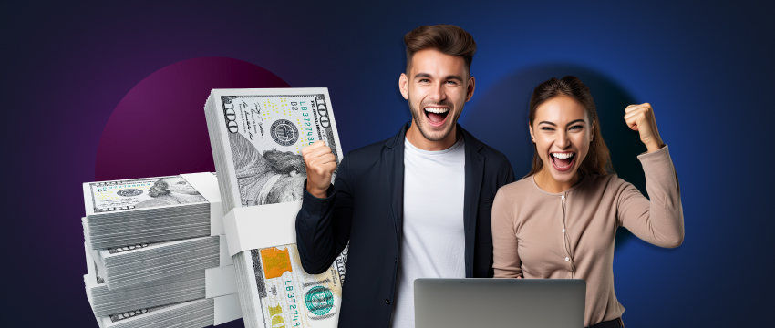 Two traders, a man and a woman, excitedly display their money and laptop, symbolizing their achievements in trading.