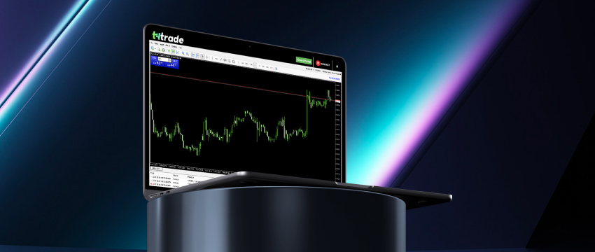 A laptop displaying a stock market interface on the screen, featuring the MT4 trading platform for forex trading.